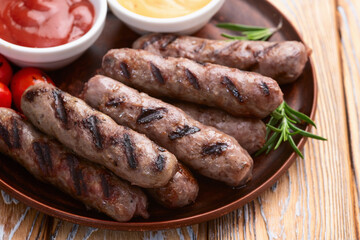Grilled beef sausages with rosemary sauce and tomatoes photography . Top view