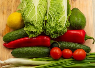 composition with fresh vegetables and fruits on wooden background
