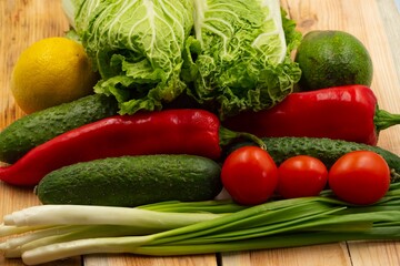 composition with fresh vegetables and fruits on wooden background