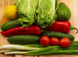 composition with fresh vegetables and fruits on wooden background
