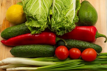 composition with fresh vegetables and fruits on wooden background