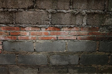 Grunce birck wall with concreate wall