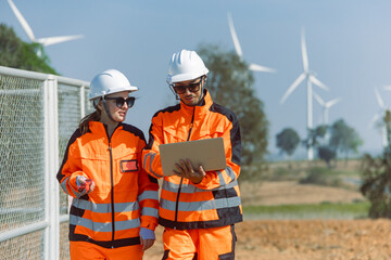 Engineer workers teamwork working together service maintenance wind turbine clean power green energy