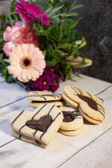 Cookies in the face of a heart for Valentine's Day with a flower in the background