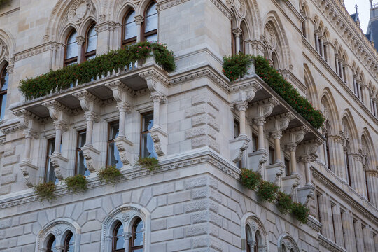 Architectural decorations of facades of gothic building in shade, fragment