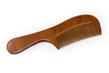 Wooden hair comb with handle on a white background