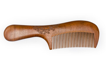 Wooden hair comb with handle on a white background