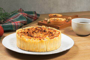 Apple crumb pie on a wooden table background. Apple crumble pie dessert, sweet and crunch with christmas ambient