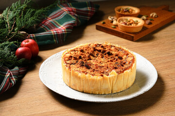 Apple crumb pie on a wooden table background. Apple crumble pie dessert, sweet and crunch with christmas ambient