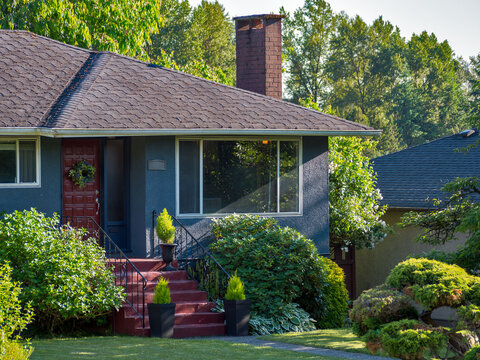 Main entrance of detached residential house on warm summer everning