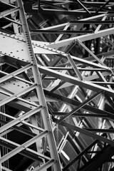 Eiffel Tower steel structure detail in black and white in Paris, France.