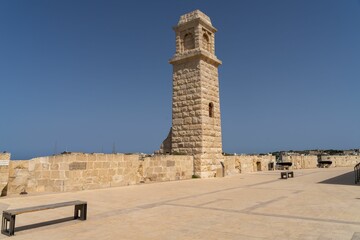 Historic Stone Tower Against Blue Sky
