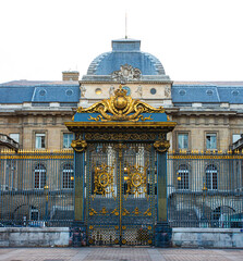 The Palais de Justice facade and the golden royal gate in the Ile de la Cite. Paris. France.