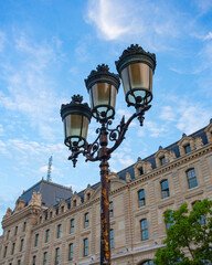 Street lamppost near the Palais de Justice in Paris, France. Decorative lamppost in front of famous landmark.