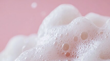 Fototapeta premium Close-Up Macro Photo of Soap Foam and Bubbles on a Pink Background: Banner with Copy Space for Laundry, Cleaning Services, Beauty, and Skin Care Concepts