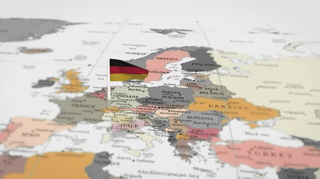 The camera rotating around Germany on the world map takes the focus. The Germany flag is waving. Germany flag waving on the map 4K Animation.