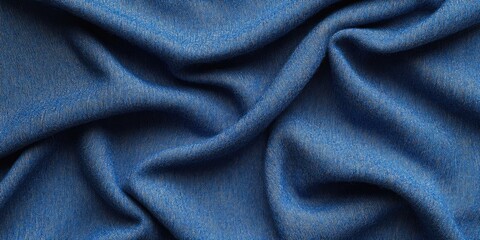 Obraz premium Soft textured blue wool fabric draped with gentle folds creating a smooth backdrop ideal for overlaying text or graphics in a serene atmosphere.