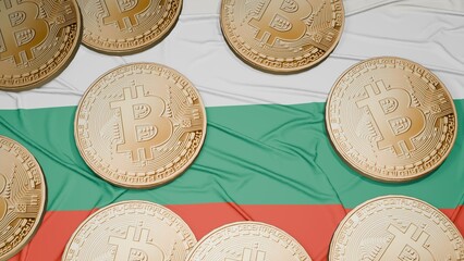 Several bitcoins are laid out on the flag of Bulgaria
