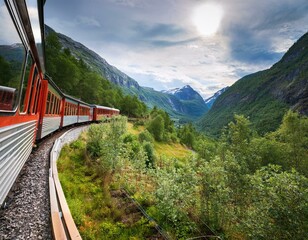 the flam railway train in norway traveling through dense mountainous vegetation between flam and myrdal in norway
