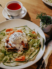 Waffle with salad, salmon, poached egg and seasonings. Healthy breakfast. Eco nutrition