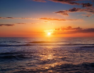 Obraz premium a stunning sunrise casting warm light over a tranquil ocean scene at dawn