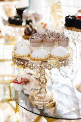 Delicious macarons and pastries decorating a luxurious candy bar buffet