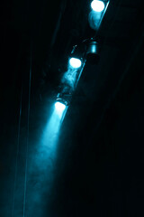 Professional spotlights and smoke on stage in theatre