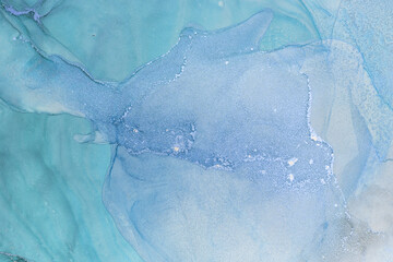 Swirls of blue and white create a captivating alcohol ink abstract artwork