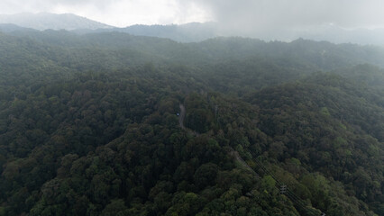 drone aerial view of signal towers and roads in valleys and forests