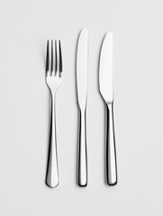 Crossed fork and knife arranged in an X shape on a neutral surface, emphasizing modern dining aesthetics and culinary experiences for various occasions
