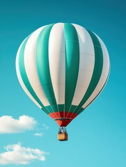 Fototapeta premium Brightly colored hot air balloon with vertical stripes soaring against a clear blue sky on a sunny day, creating a picturesque scene of leisurely adventure