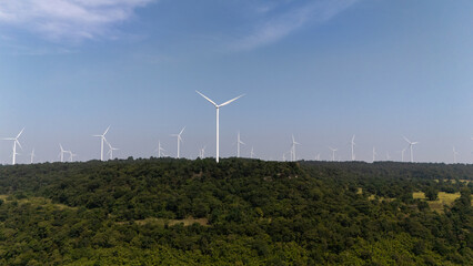 Wind turbines generate electricity at sunset in Europe and Asia