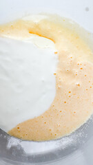 Close-up of batter being mixed in a bowl, capturing the concept of baking preparation for holiday desserts