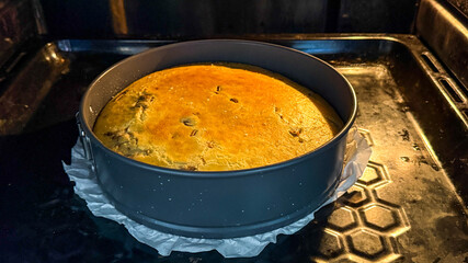 Golden-brown cheesecake baking in an oven, symbolizing culinary skills and home baking for Thanksgiving celebrations