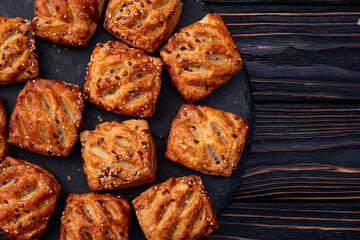 Flaky Pastries with Sesame Seeds on Slate