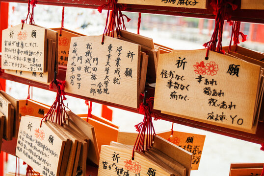 wooden fortune telling plaques outside a temple in Asakusa, Japan