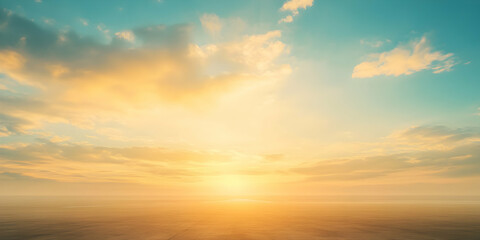 Fototapeta premium Golden Hour Horizon: A breathtaking panoramic view of a vibrant sunset, where the sun dips below the horizon, painting the sky with warm hues of gold, orange, and soft turquoise.