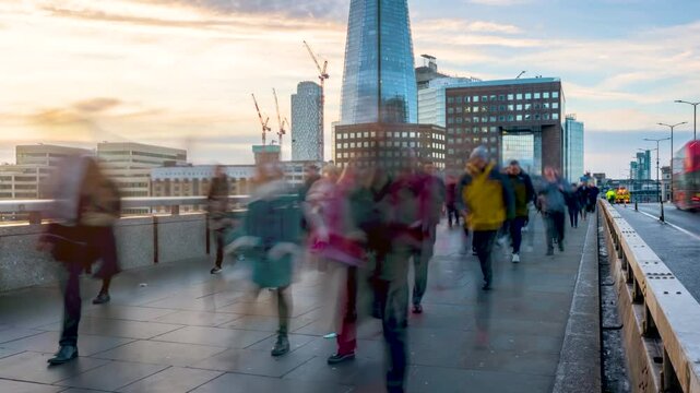 Time lapse view of people rushing in blurred motion into their offices in London, England, during early morning sunrise