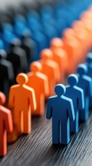 Obraz premium Visualizing Demographics with Silhouette Figures in Various Colors and Sizes on a Dark Background
