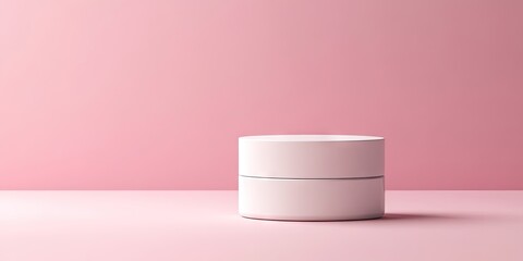 Minimalistic white cosmetic jar on a soft pink background centered with ample copy space on the right for branding and text placement.