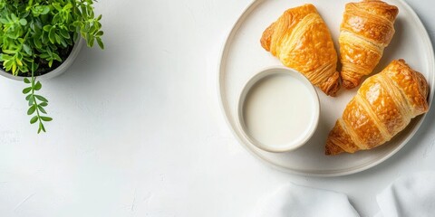 Crispy pastries on a white plate with soy milk and a green bonsai plant in a stylish composition featuring ample copy space and soft focus elements.