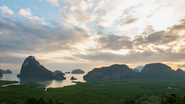 Time lapse view Phang Nga bay with mountain and cliff with stunning morning sunrise and beautiful sky. Landscape scene from Samet Nangshe viewpoint famous nature travel landmark of Thailand.	
