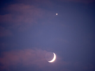 The bright Moon and the visible light of Venus a short distance from it are visible with the naked eye as well as with a camera lens in January 2025. © Marek