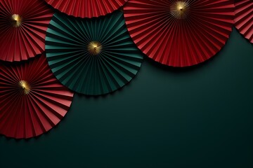 Red and gold paper fans on dark teal background. Festival or wedding traditional asian decoration. Chinese New Year, Mid-Autumn Festival. Frame with copy space for design greeting card, banner