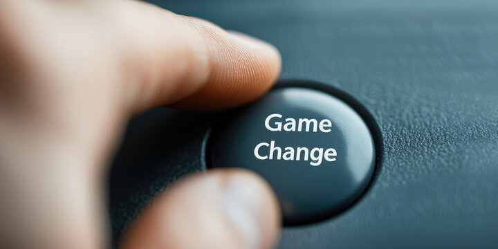 A finger presses a button with text Game Change. Game changer creative concept. Rule change, leader, self-expression