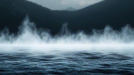 Obraz premium Ethereal Fog Over Water with Mountain Backdrop in Dark Minimalist Scene