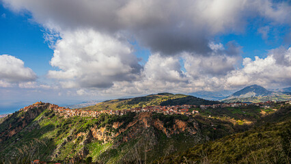 top view of the village of Grisolia with a cloudy sky in the background, Cosenza