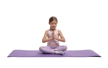 Little girl exercising on fitness mat against white background