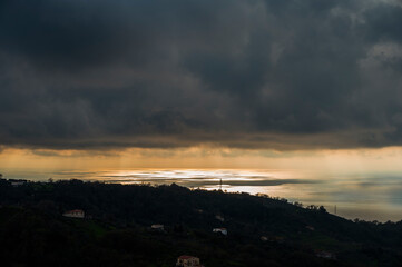 sunset over the Tyrrhenian Sea during a spring day with a cloudy sky, seen from Maierà, Cosenza