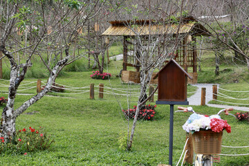 serene garden with wooden gazebo and bicycle with flower basket